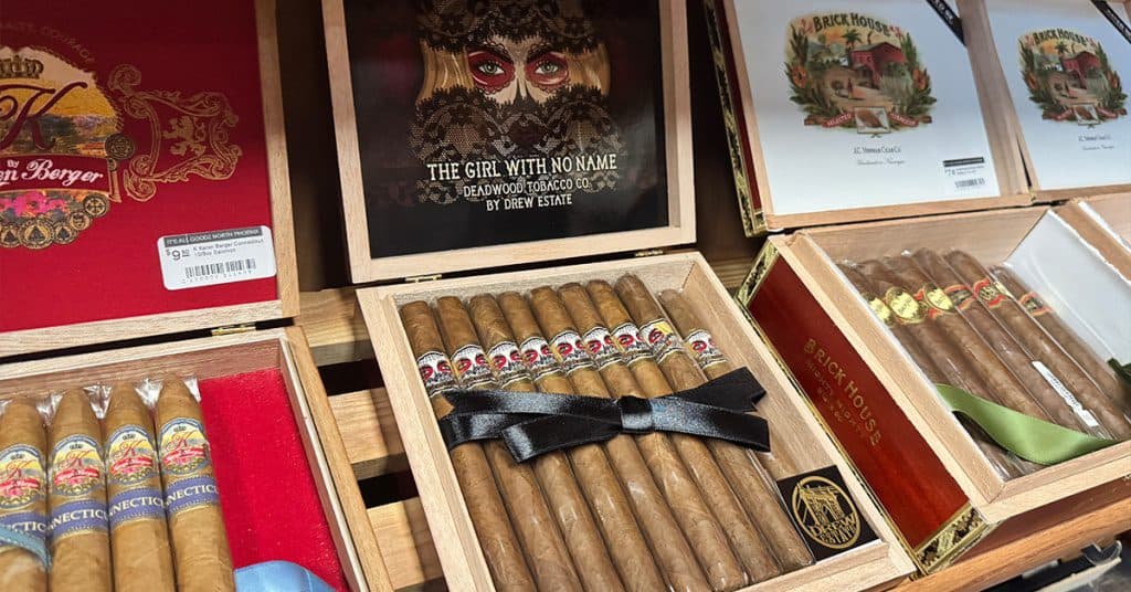 Premium cigars on display at It’s All Goodz Smoke Shop in Phoenix, perfect for a day on the golf course